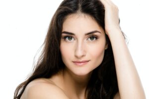 Beautiful Young Adult Woman with Clean Fresh Skin Portrait.